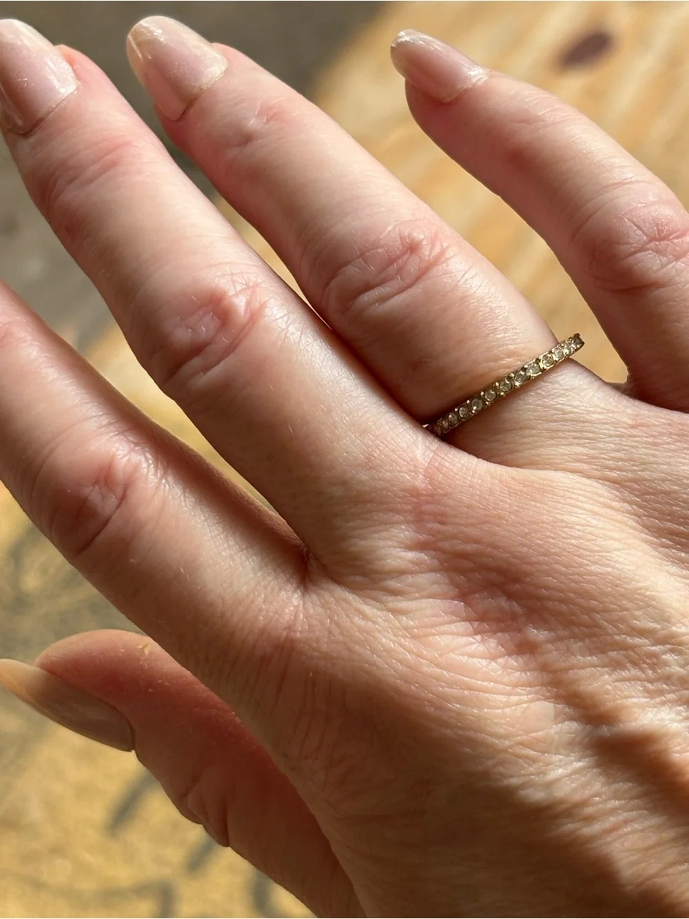 Delicate Gold Tone Eternity Band with Clear Stones
